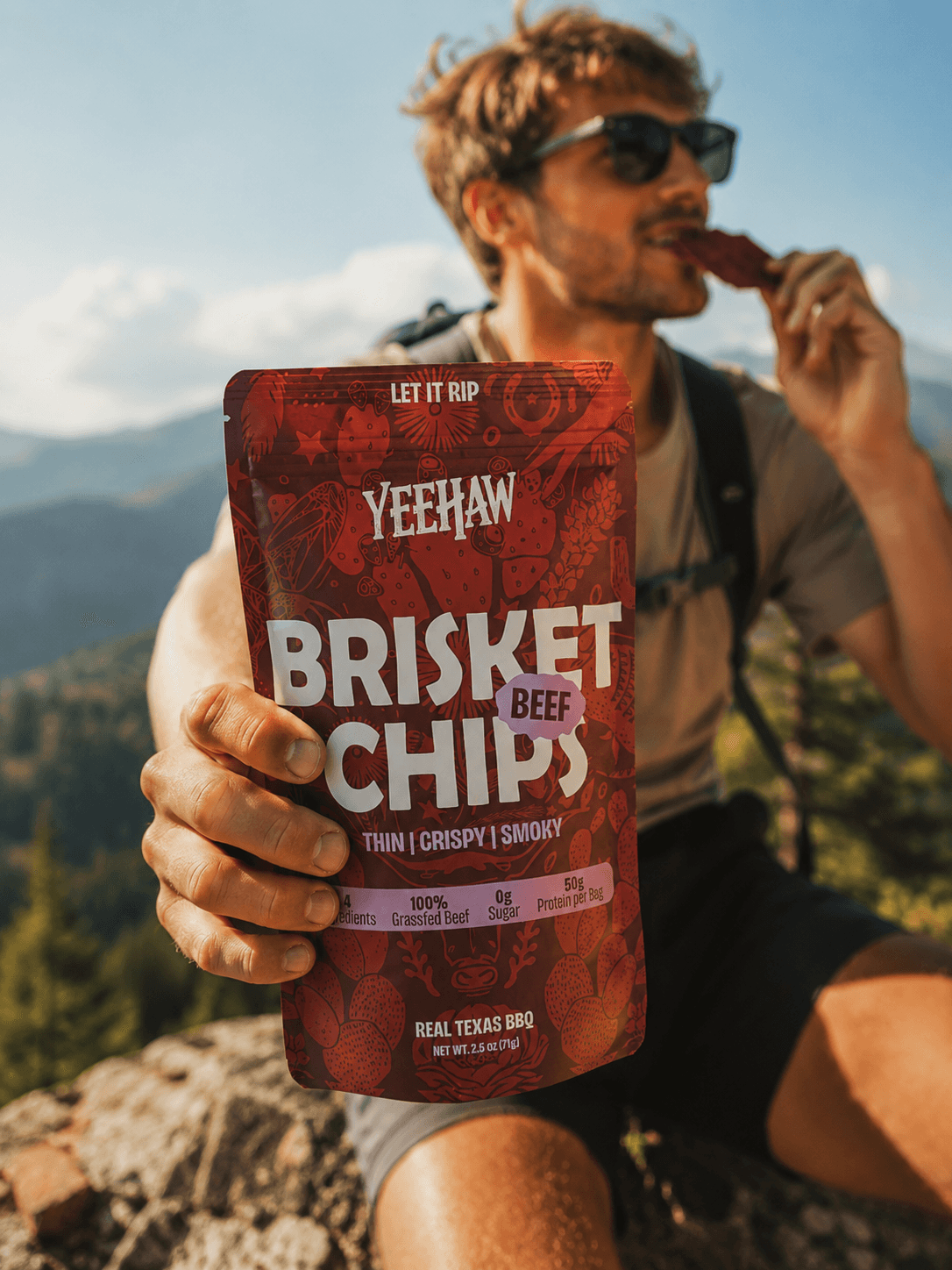 Yeehaw Snacks brisket beef chips pouch held outdoors